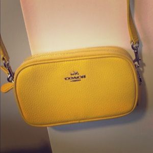 Coach wallet sized yellow wristlet/crossbody
